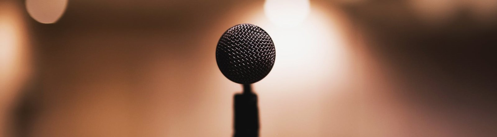 page hero, a microphone on a stage