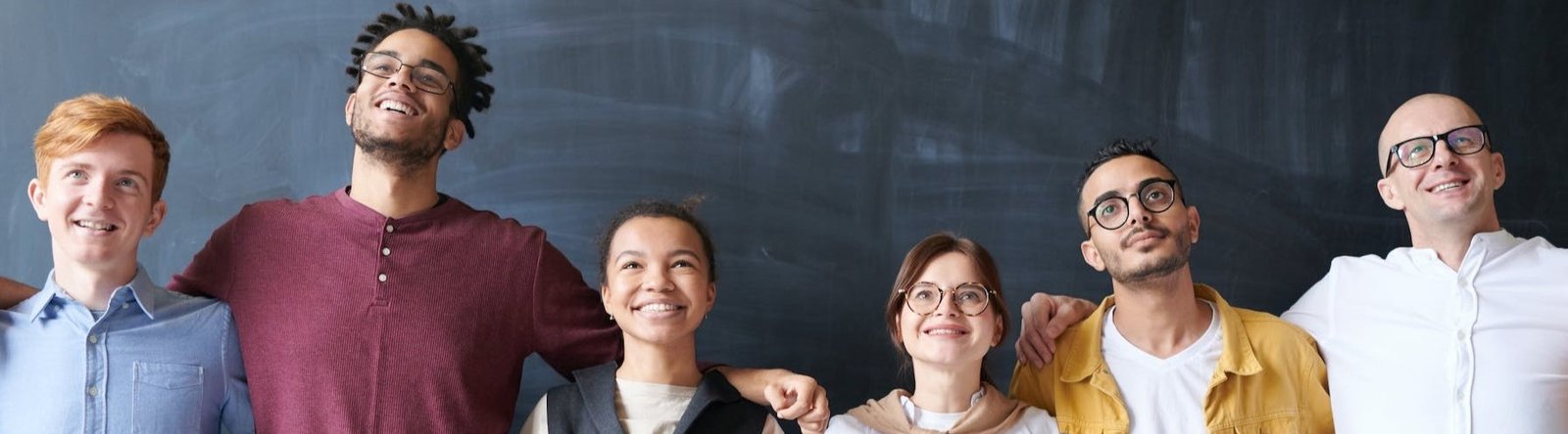 page hero, a group of people by a chalkboard