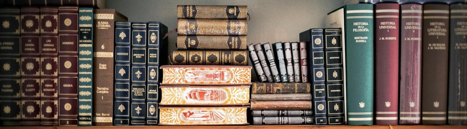 page hero, old books on a shelf